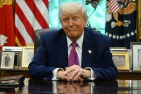 US President Donald Trump listens during an announcement about the Golden Dome missile defense shield, in the Oval Office of the White House on May 20, 2025, in Washington, DC